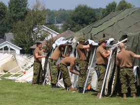Members of the 2nd Canadian Mechanized Brigade Group from CFB Petawawa erect enough tents to house 500 asylum seekers in addition to the room for 300 inside the Nav Centre in Cornwall in 2017.