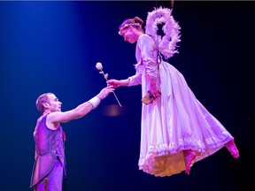 Montreal-based acrobat Marie Christine Ménard-Bergeron, right, performs during Corteo.