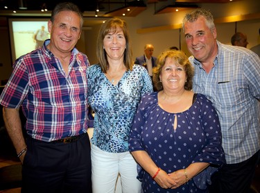 From left, Gary Tyo, Rossie Whittenberg, Anne Avon-Russo and Gord Schultz, who have worked with Brad Hampson over the years.