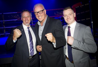 From left, Ottawa Police Service Insp. Ken Bryden, Ringside for Youth ambassador Gerry Cooney and volunteer Griffin Rohonczy.