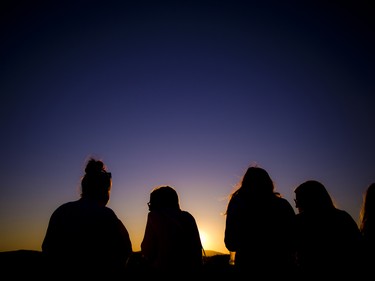 Ladies chatted together as the sun set over the Ottawa River.