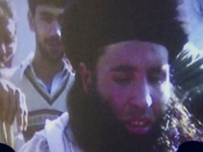In this file image made from video broadcast on Thursday, Nov. 7, 2013, undated footage of Mullah Fazlullah is shown on a projector in Pakistan.
