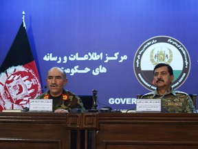 Afghan Army Chief of Staff, General Sharif Yaftali (L) and Deputy Minister, General Akhtar Mohammad Ibrahimi (R) look on during a press conference in Kabul on June 7, 2018.