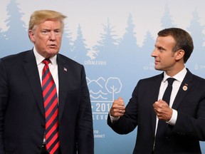 U.S. President Donald Trump, left, and French President Emmanuel Macron hold a meeting on the sidelines of the G7 Summit in La Malbaie, Que., on Friday.