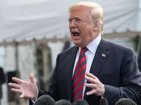 In this file photo taken on June 8, U.S. President Donald Trump shares a few words with the press before departing the White House for the G7 summit .