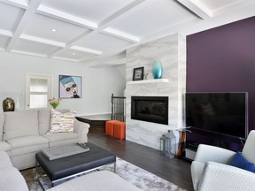 In re-designing the space to be open and inviting, the team at Amsted Design-Build added a coffered ceiling to the living room to visually expand the height.