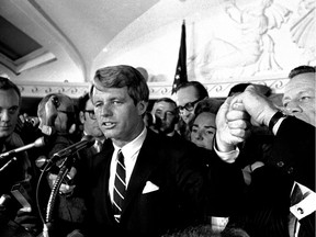 FILE - This June 5, 1968 file photo shows Sen. Robert F. Kennedy speaking at the Ambassador Hotel in Los Angeles, following his victory in the previous day's California primary election. The New York senator was shot just after jubilantly proclaiming victory in California's Democratic presidential primary election.