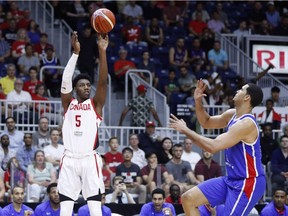 Canada's R.J. Barrett puts up a shot over the Dominican Republic's Eloy Antonio Camacho Vargas, right, during Friday's game in Toronto.