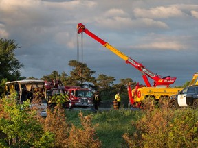 Tow trucks at the scene of the bus crash on the 401 west of Prescott.