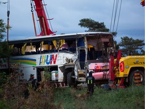 Tow trucks at the scene of the bus crash on the 401 west of Prescott.