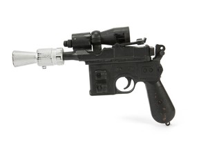 This photo provided by Julien's Auctions shows character Han Solo's BlasTech DL-44 blaster from the Star Wars trilogy film "Return of the Jedi" (Lucasfilm, 1983) that sold for $550,000 at Julien's Auctions Hollywood Legends auction at Planet Hollywood Resort & Casino, in Las Vegas, on Saturday, June 23, 2018. Julien's Auctions say Ripley's Believe It Or Not purchased the sci-fi weapon. (Julien's Auctions via AP)