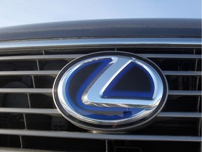 The front grill logo of a Lexus