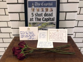 At the Maryland State House, letters and flowers form a memorial Friday, June 29, 2018, in Annapolis, Md., from Gov. Larry Hogan, state Senate President Thomas V. Mike Miller and House Speaker Michael Busch at the state house.