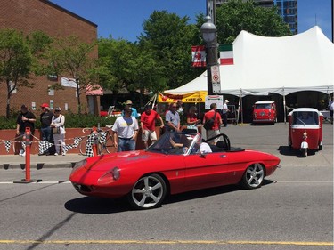 Vintage Italian vehicles make their way onto Preston Street for the Ferrari parade at Italian Week.