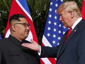 In this June 12, 2018, file photo, U.S. President Donald Trump, right, meets with North Korean leader Kim Jong Un on Sentosa Island in Singapore.