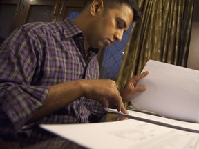 Pranav Johri looks at a report at his home in New Delhi, India on April 10, 2018. Pranav received phage therapy to fight two drug-resistant infections.