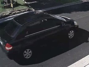 A black, four-door 2007 to 2011 Nissan Versa sedan is shown in this police handout photo taken from video surveillance.
