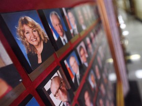 A picture of Senator Lynn Beyak accompanies other Senators official portraits on a display outside the Senate on Parliament Hill in Ottawa on Thursday, Sept. 21, 2017. Sen. Beyak is embracing an online survey that shows that half of respondents think the government apologizes too much for residential schools and that Indigenous people should integrate more even if it means losing their culture.