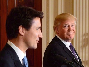 Prime Minister Justin Trudeau and U.S. President Donald Trump take part in a joint press conference at the White House in Washington, D.C., on February 13, 2017. Donald Trump's leading economic adviser says the U.S. president wants to strike separate bilateral trade deals with Canada and Mexico rather than continue renegotiating the North American Free Trade Agreement.