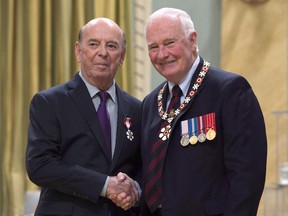 Governor General David Johnston invests Bob Cole, from St.John's, Nfld. as a Member of the Order of Canada during a ceremony at Rideau Hall Friday September 23, 2016 in Ottawa. Veteran hockey broadcaster Bob Cole isn't calling NHL playoff games for the first time in his career, but he's still open to returning to the broadcast booth next season.THE CANADIAN PRESS/Adrian Wyld