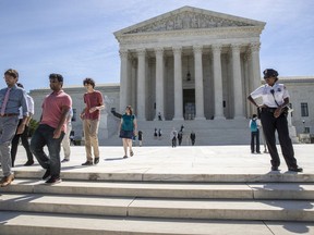 Visitors depart the Supreme Court early Monday, June 25, 2018. The justices are expected to hand down decisions this week as the court's term comes to a close.