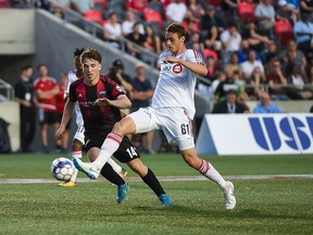 Ottawa Fury FC's Gabriel Wiethaeuper-Balbinotti (14) tries to defend against Rocco Romeo (61) of Toronto FC II during a United Soccer League match at TD Place Stadium in Ottawa, ON. Canada on May 31, 2018.