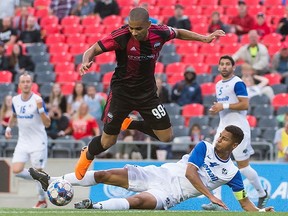Ottawa's Tony Taylor hops over an opponent during the Canadian Championship match between the Fury FC and AS Blainville at TD Place Stadium on Wednesday, June 27, 2018.