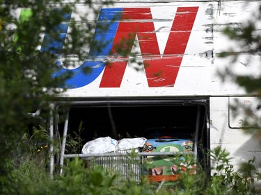 Passengers' items in the luggage hold are seen in a tour bus that was involved in a crash on Highway 401 West, near Prescott, Ont. on Monday, June 4, 2018.