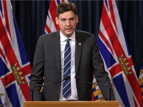 Attorney General David Eby joins Premier John Horgan and Environment Minister George Heyman to discuss filing a court case regarding oil jurisdiction in B.C. during a press conference in the press theatre at Legislature in Victoria, B.C., on Thursday April 26, 2018.