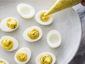 Photo provided by America's Test Kitchen  shows classic deviled eggs . This recipe appears in the "The Complete Make-Ahead Cookbook."