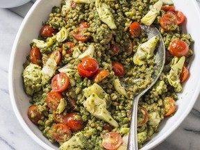 This undated photo provided by America's Test Kitchen in May 2018 shows pesto farro salad. This recipe appears in the cookbook "Nutritious Delicious."