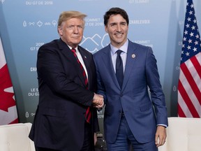 Canada's Prime Minister Justin Trudeau meets with U.S. President Donald Trump at the G7 leaders summit in La Malbaie, Que., on Friday, June 8, 2018.