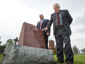 Reg Gamble, (R), semi-retired funeral director, and John Bowes of Kinkaid & Loney Monuments, get a look at the monument that they and a group of Almonte residents have managed to erect for a long-forgotten hero, George Eccles. In 1909, as a telegraph operator on a ship, he died when the ship sank off the coast of B.C.