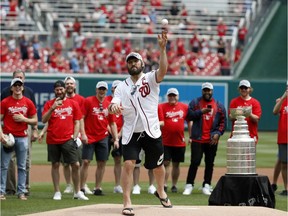 Washington Capitals star Alex Ovechkin throws a second ceremonial first pitch before Saturday's National League game between the Nationals and the Giants.