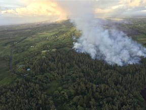In this photo taken Friday by the U.S. Geological Survey, the easternmost Fissure 8 lava flow in the vicinity of Kapoho Crater is seen near Pahoa, Hawaii. U.S. Geological Survey via AP