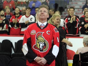 Daniel Alfredsson watches as a banner with his retired Senators jersey No. 11 is raised to the rafters of Canadian Tire Centre on Dec. 29, 2016.