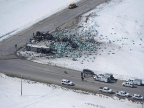 The wreckage of a fatal crash outside of Tisdale, Sask., is seen Saturday, April, 7, 2018. Saskatchewan's premier suggested asking the military for help with autopsies following the deadly Humboldt Broncos crash.