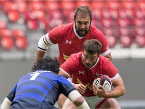 Eric Howard of Kanata, top, provides support to a teammate in a Canadian senior men's rugby quad match.
Rugby Canada photo