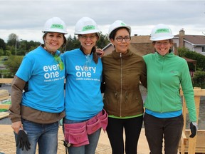 Future Habitat Homeowner Annie Aningmiuq (third from left) poses with the MNP team.