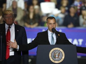 In this April 28, 2018 file photo, President Donald Trump, left, watches as Corey Lewandowski, right, his former campaign manager for Trump's presidential campaign.