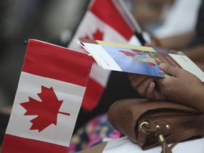 One hundred new Canadian's - from 43  countries - were sworn in at Pearson International Airport by Citizenship judge Harry Dhaliwal. It was part of a mass pre-Canada Day celebration with Canada's Citizenship and Immigration Minister, Chris Alexander in attendance on Monday June 30, 2014.