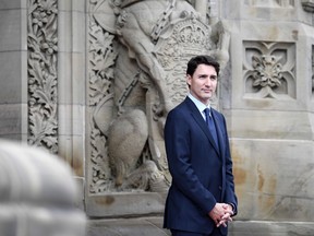 Prime Minister Justin Trudeau waits for the arrival of President of France Emmanuel Macron on Parliament Hill for a visit in Ottawa on Wednesday, June 6, 2018.