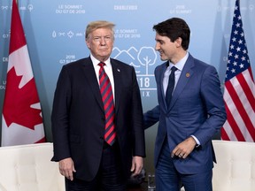 Canada's Prime Minister Justin Trudeau meets with U.S. President Donald Trump at the G7 leaders summit in La Malbaie, Que., on Friday, June 8, 2018.