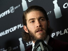 Mike Hoffman of the Ottawa Senators talks to the media before boarding the plane at the Ottawa International Airport, May 24, 2017.