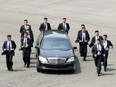North Korean Leader Kim Jong-un in a limousine escorted by his bodyguards during the Inter-Korean Summit on April 27, 2018 in Panmunjom, South Korea.