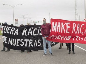 Pro-immigration demonsrators block a highway next to a the U.S./Canada border near Lacolle, Que., earlier this year.