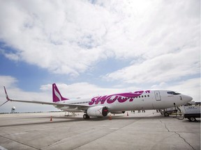 A Swoop Airlines Boeing 737 is on display during their media event, Tuesday, June 19, 2018 at John C. Munro International Airport in Hamilton, Ont.