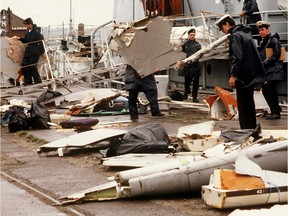 (FILES) Irish naval authorities bring ashore debris from an Air India Boeing 747, 28 June 1985 in Cork, Ireland. The aircraft crashed 23 June 1985 with 329 people on board.