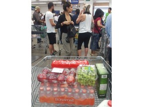 Shoppers wait in line at a Sam's Club in Mexico City, Thursday, May 31, 2018. The Trump administration announced Thursday it will impose tariffs on steel and aluminum imports from Europe, Mexico and Canada after failing to win concessions from the American allies. Mexico retaliated quickly saying it would penalize U.S. imports including pork bellies, apples, grapes, cheeses and flat steel.