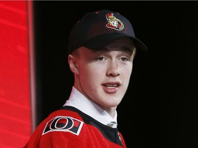 Jacob Bernard-Docker wears team gear after being selected by the Senators with the 26th pick of the first round on Friday night in Dallas.